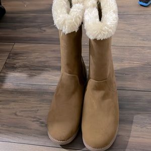 Brown and white fuzzy boots